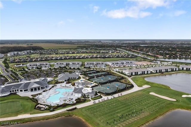 bird's eye view with view of golf course and a water view