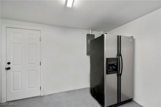 kitchen with light speckled floor and stainless steel fridge