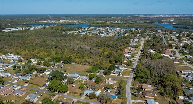 aerial view featuring a water view and a view of trees