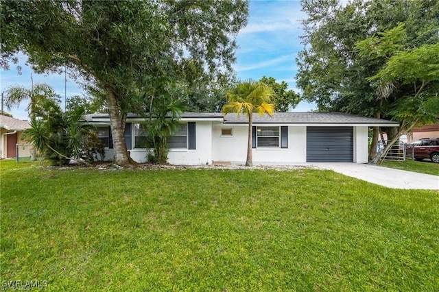 ranch-style home with a garage, concrete driveway, a front yard, and stucco siding