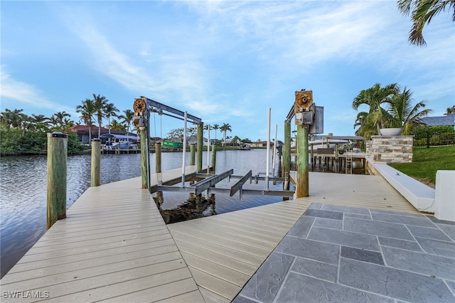 view of dock featuring a water view and boat lift