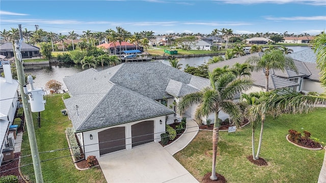 aerial view featuring a water view and a residential view