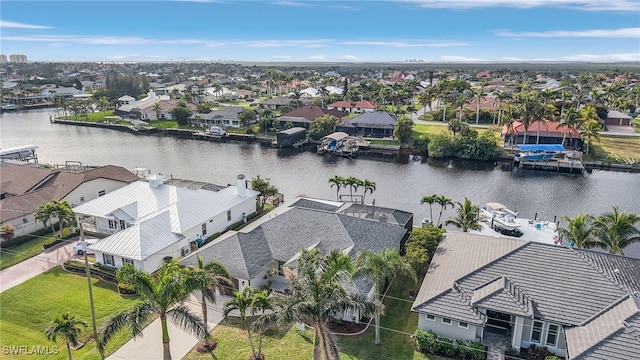 bird's eye view featuring a residential view and a water view