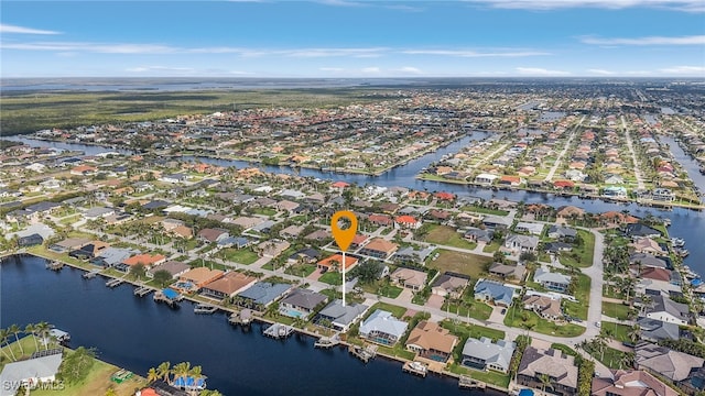 aerial view with a water view and a residential view