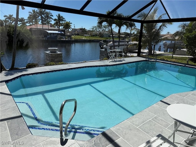 view of swimming pool with glass enclosure, a patio, a water view, fence, and a fenced in pool