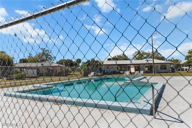 pool featuring a patio and fence