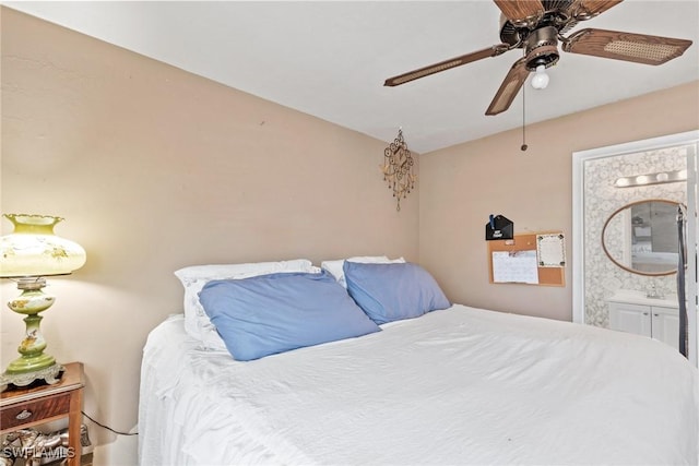 bedroom with ceiling fan and connected bathroom