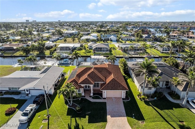 birds eye view of property featuring a residential view and a water view