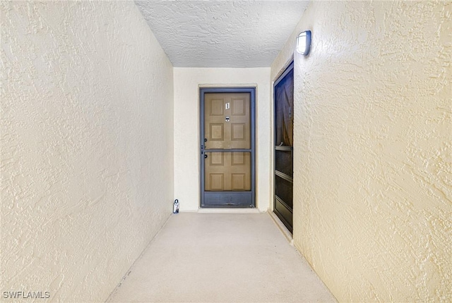 property entrance featuring stucco siding