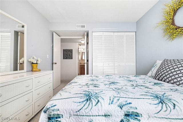 bedroom featuring carpet, visible vents, and a closet