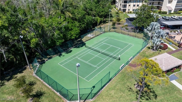 view of tennis court with fence