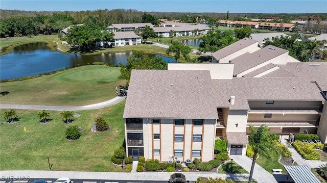 aerial view featuring golf course view and a water view