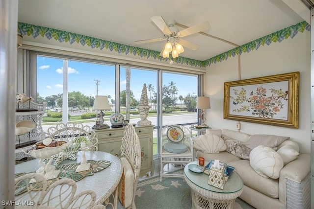 living area featuring a ceiling fan