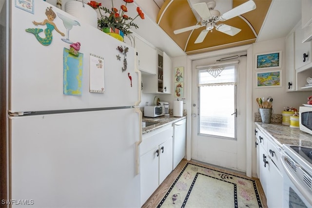 kitchen with open shelves, white appliances, light countertops, and white cabinetry