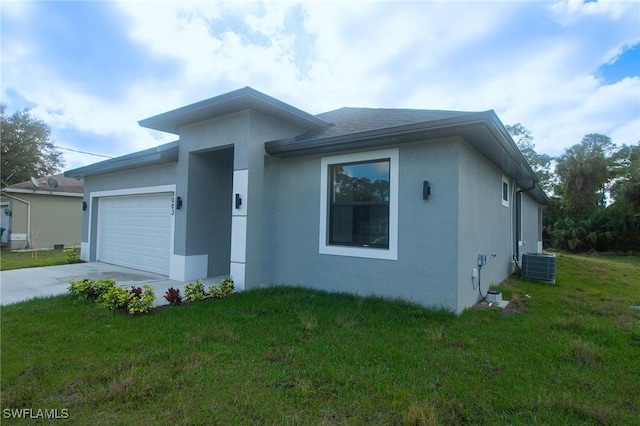 view of front facade with an attached garage, central air condition unit, concrete driveway, stucco siding, and a front lawn