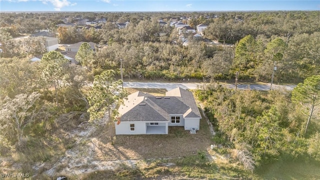 aerial view featuring a forest view