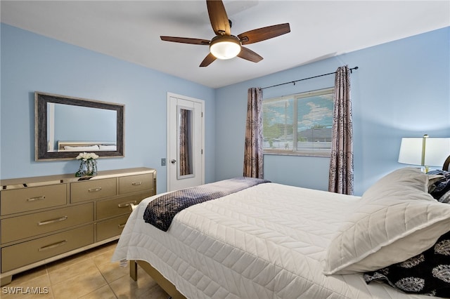 bedroom featuring light tile patterned floors and ceiling fan