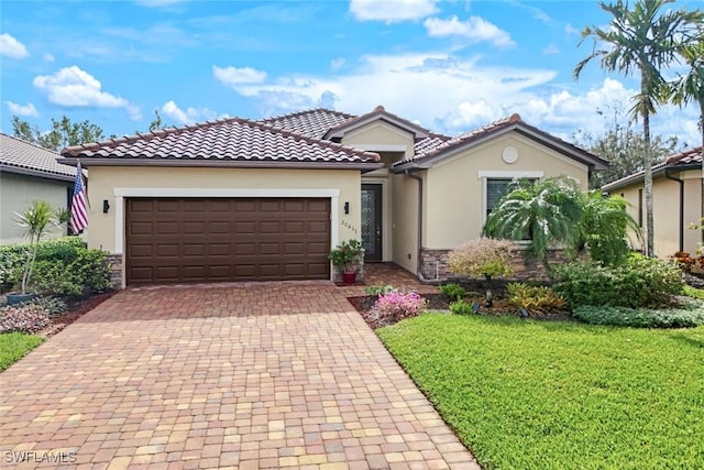 20433 Cypress Shadows Blvd, Estero, FL 33928 - mediterranean / spanish house with stone siding, stucco siding, an attached garage, a front yard, and decorative driveway