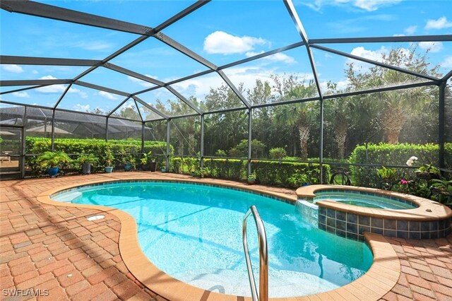 20433 Cypress Shadows Blvd, Estero, FL 33928 - view of pool featuring a pool with connected hot tub, a patio, and glass enclosure