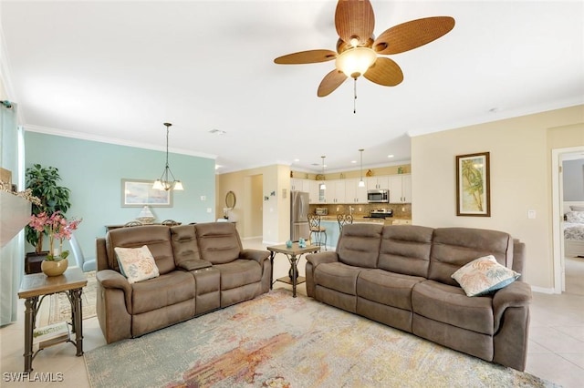 living room featuring light tile patterned floors, recessed lighting, ornamental molding, baseboards, and ceiling fan with notable chandelier