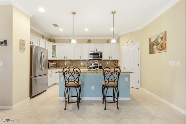 20433 Cypress Shadows Blvd, Estero, FL 33928 - kitchen with appliances with stainless steel finishes, tasteful backsplash, a kitchen breakfast bar, white cabinetry, and crown molding