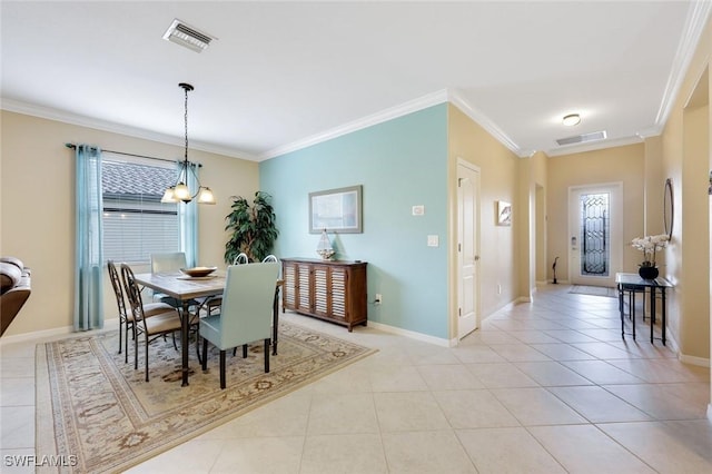 dining room featuring ornamental molding and light tile patterned flooring