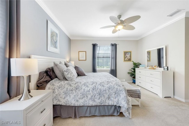 bedroom with light colored carpet, visible vents, ornamental molding, a ceiling fan, and baseboards