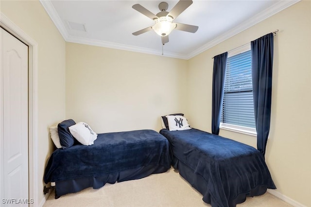 bedroom featuring carpet, baseboards, ceiling fan, and crown molding