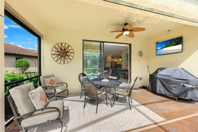 sunroom / solarium with ceiling fan