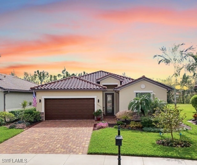 20433 Cypress Shadows Blvd, Estero, FL 33928 - mediterranean / spanish-style house with stucco siding, decorative driveway, a front yard, a garage, and a tile roof