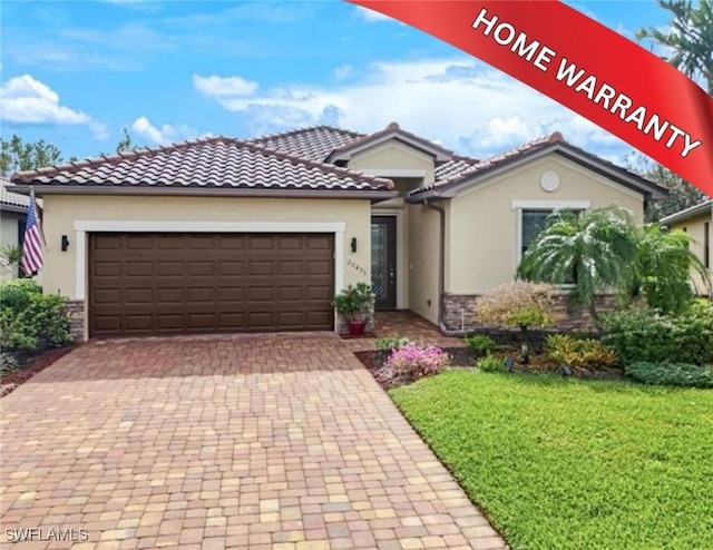 20433 Cypress Shadows Blvd, Estero, FL 33928 - mediterranean / spanish home with stone siding, stucco siding, an attached garage, and decorative driveway
