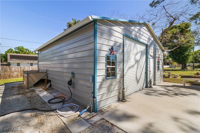 1622 Piney Rd, North Fort Myers, FL 33903 - view of outdoor structure featuring fence and an outbuilding