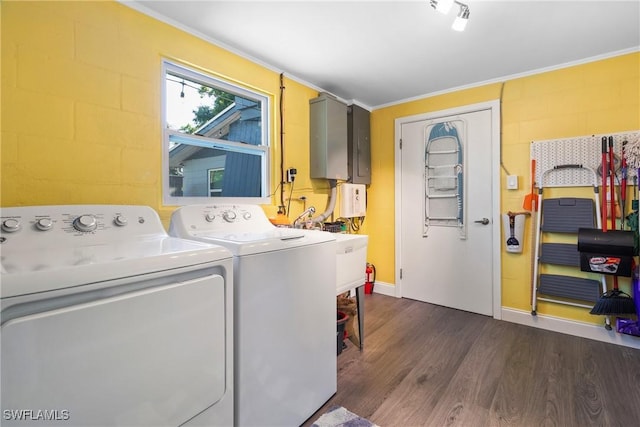 1622 Piney Rd, North Fort Myers, FL 33903 - washroom with washing machine and dryer, dark wood-type flooring, and crown molding
