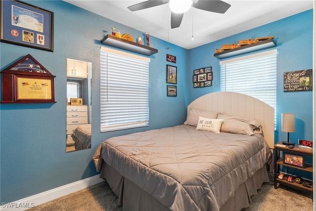 carpeted bedroom with baseboards and ceiling fan