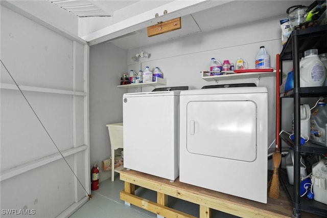 laundry room with laundry area and washing machine and dryer