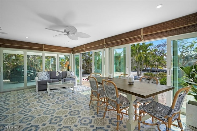 sunroom featuring ceiling fan