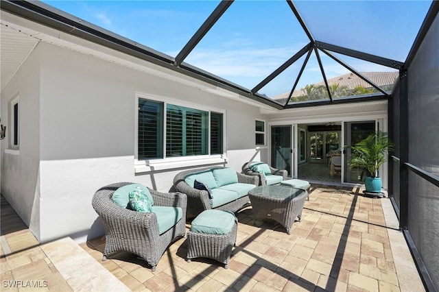 view of patio / terrace with glass enclosure and an outdoor living space