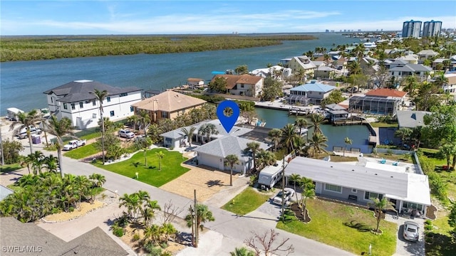 birds eye view of property with a residential view and a water view