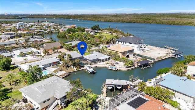 bird's eye view featuring a water view and a residential view