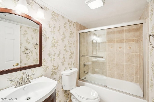 full bath featuring combined bath / shower with glass door, vanity, toilet, and wallpapered walls