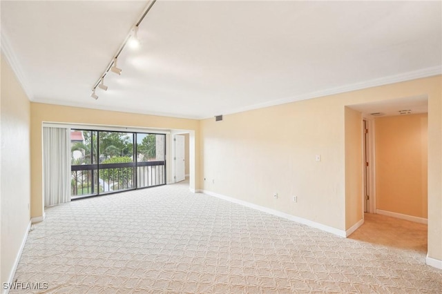 unfurnished room with light carpet, ornamental molding, visible vents, and baseboards