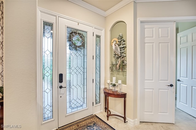 entryway featuring light tile patterned flooring, baseboards, and ornamental molding