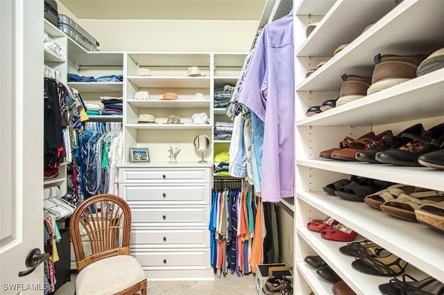 spacious closet with tile patterned floors