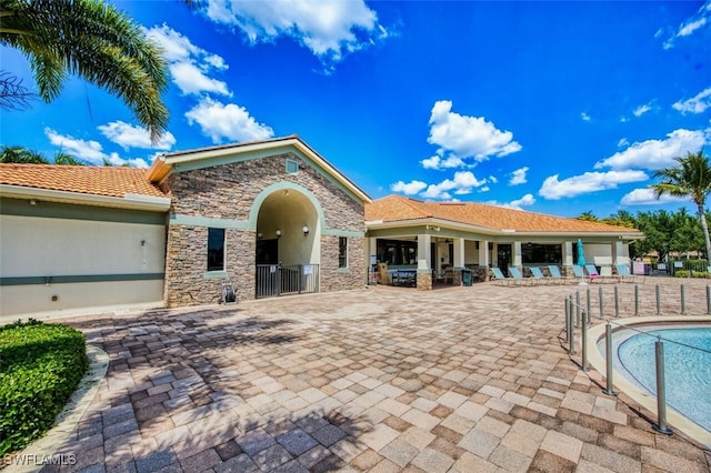 exterior space featuring a patio area and fence