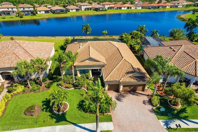 bird's eye view featuring a residential view and a water view