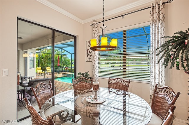 dining area featuring ornamental molding and a sunroom