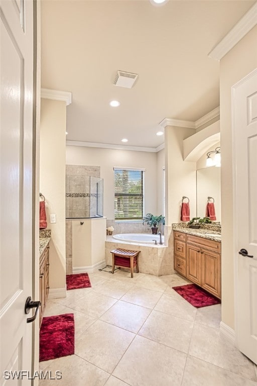 full bathroom with visible vents, a garden tub, ornamental molding, and vanity