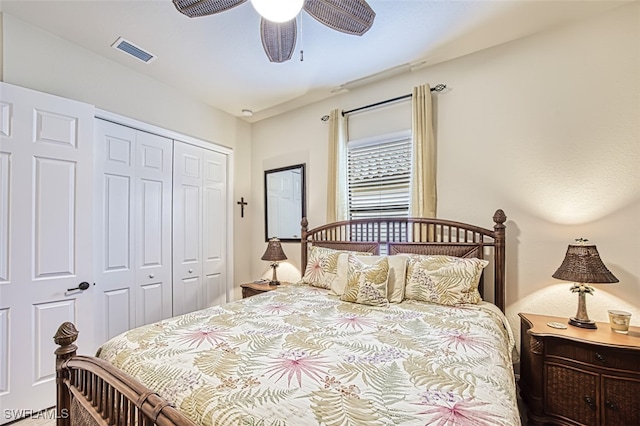 bedroom with visible vents, a closet, and ceiling fan