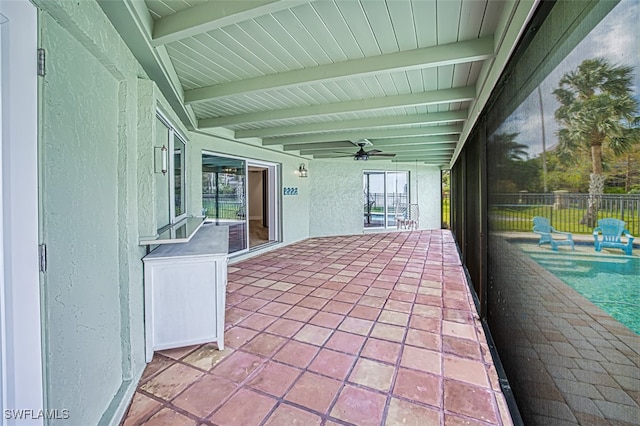 view of patio with a ceiling fan and fence