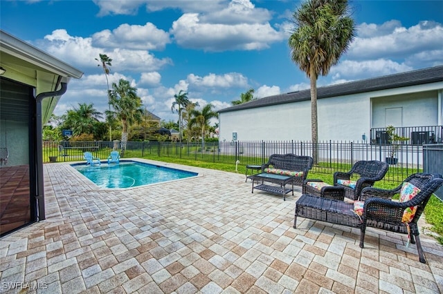 view of pool with a patio area, a fenced backyard, and a fenced in pool